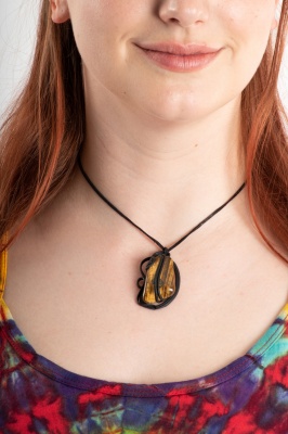 Artisan swirly pendant with tigers eye